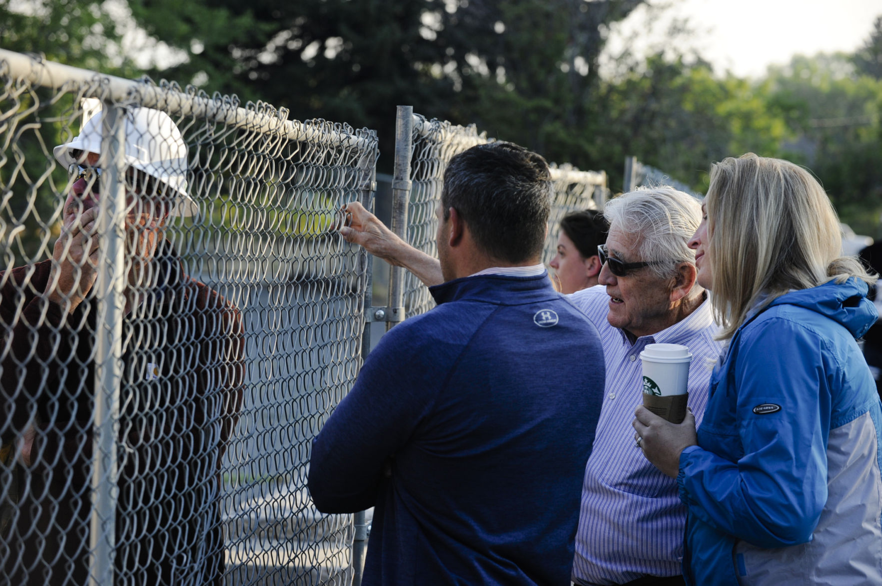 Superintendent Jack Copps, center, and Kalli Kind, Helena Public Schools Director of Support Services, watch the demolition process of Central School Monday morning.